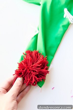 A green sleeve with a fake red flower