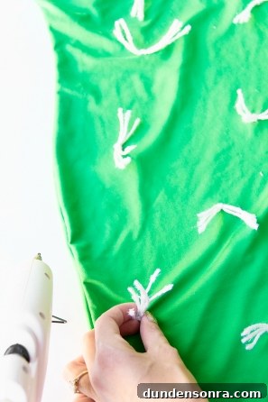 Green shirt with white strings in it