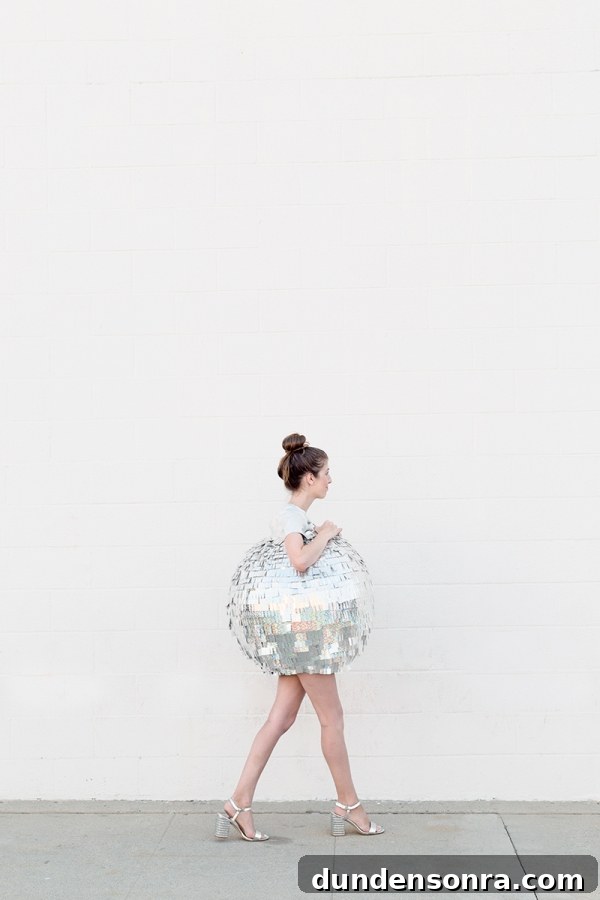 DIY Mirrored Disco Ball Costume Ideas for Halloween and Parties 3 A woman dressed as a disco ball