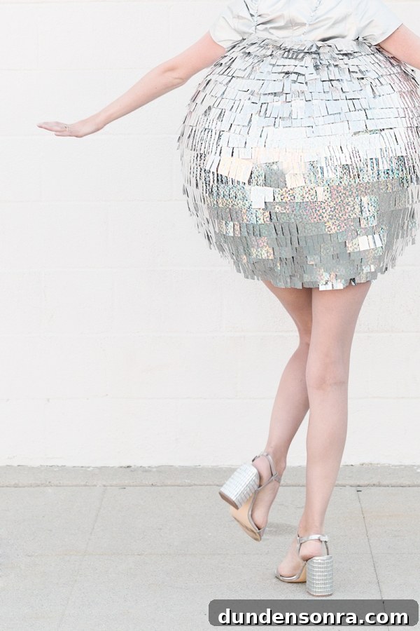 DIY Mirrored Disco Ball Costume Ideas for Halloween and Parties 4 A woman dressed as a disco ball