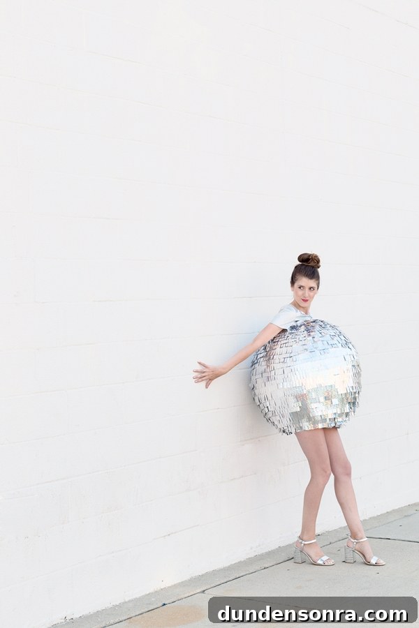 DIY Mirrored Disco Ball Costume Ideas for Halloween and Parties 10 A woman dressed as a disco ball