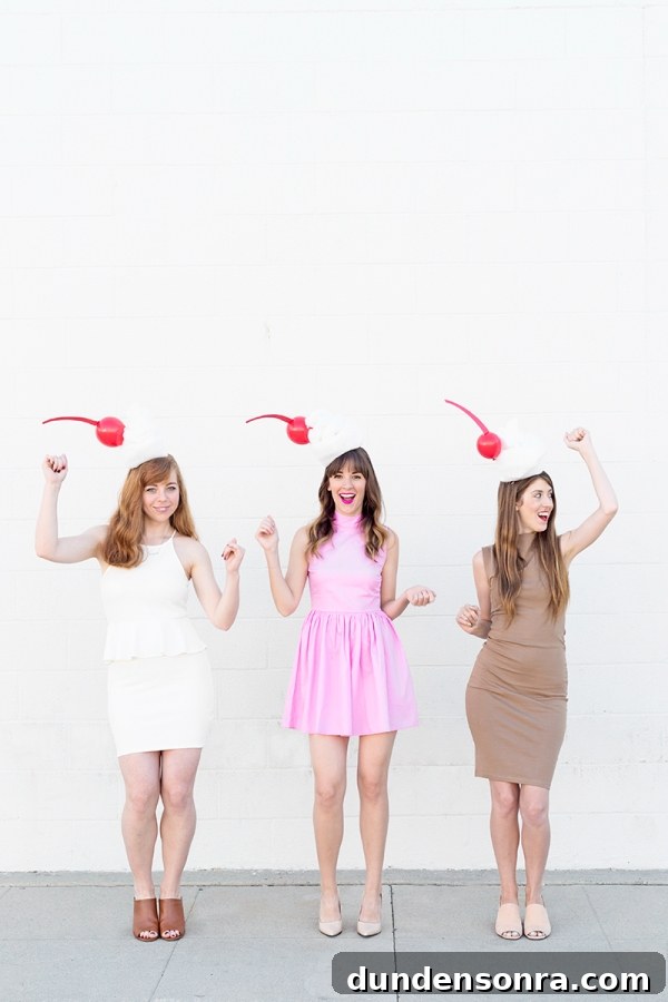 Three girls dressed in milkshake costumes