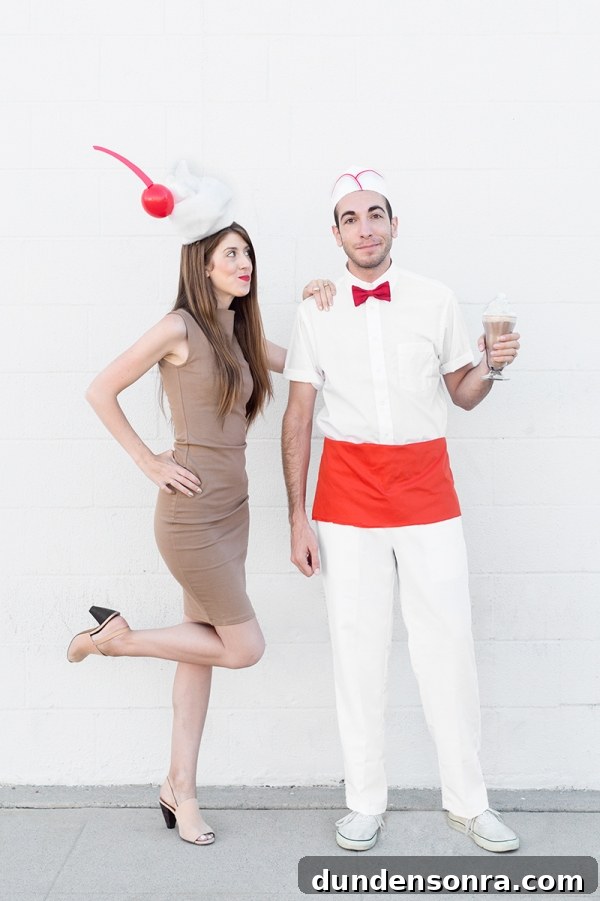 A woman dressed as a milkshake and a man dressed as a milk man 