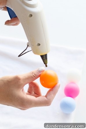 Someone gluing a ball