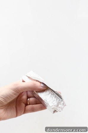 DIY Gumball Machine Costume Ideas for Halloween & Parties 9 Someone holding foil