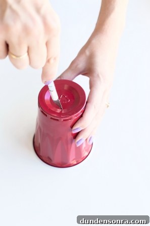 Someone cutting a solo cup