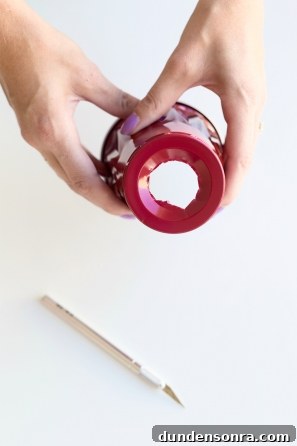 DIY Pumpkin Gumball Machine Decoration for Fall Parties 6 A solo cup with a hole in it