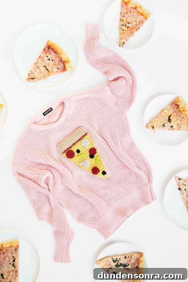 A pizza sweater and pizza