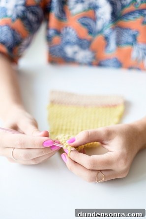 Someone sewing something yellow