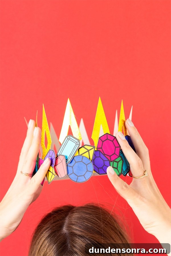Someone holding a paper crown 