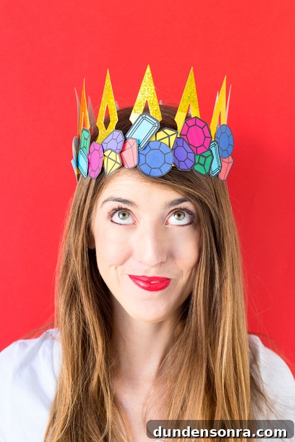 A woman wearing a paper crown