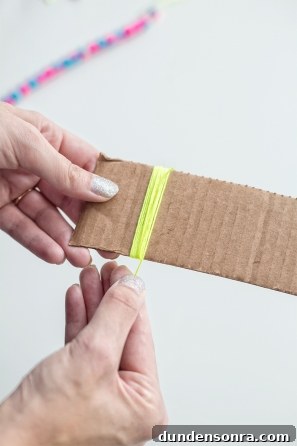 Handmade Friendship Bracelets: Patterns, Tips & Tutorials 7 Someone holding cardboard