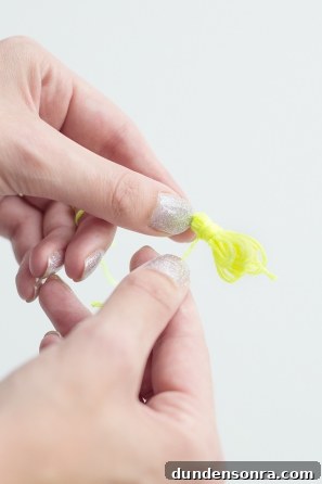 Handmade Friendship Bracelets: Patterns, Tips & Tutorials 9 Someone holding neon string