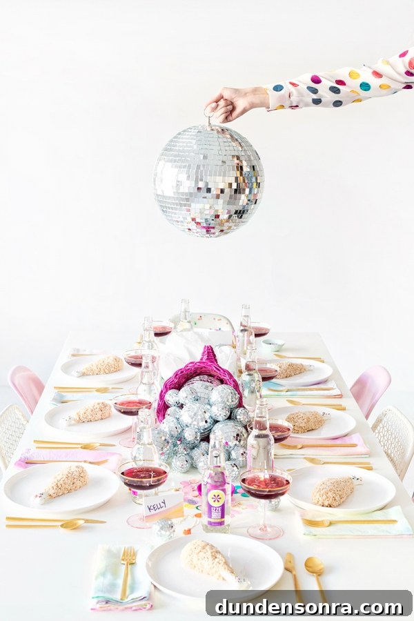 A dining table with decor and disco balls 