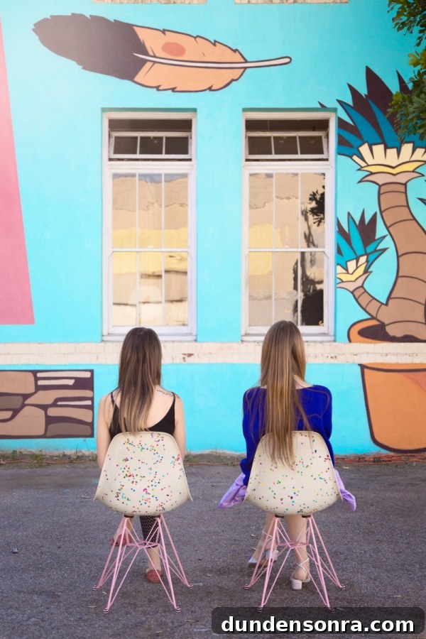 Studio DIY and Modernica Confetti Chair Reveal + Giveaway 12 Two girls sitting in front of a mural
