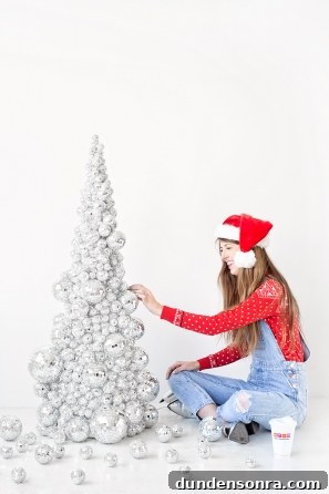 A person wearing a costume, with Christmas Tree