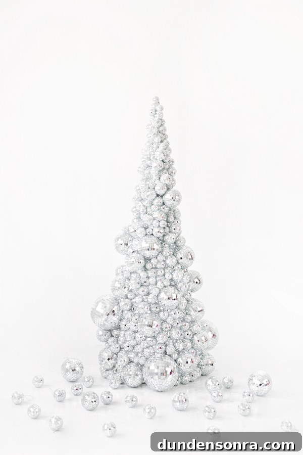 A silver ornament Christmas tree