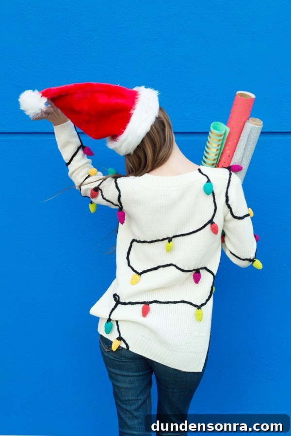 Someone wearing a christmas light sweater