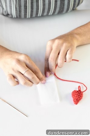 Someone sewing an item