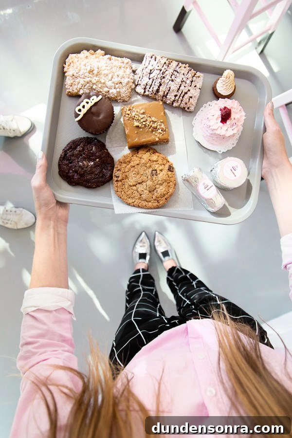 Sugar Fix: Cake Monkey — Unique Dessert Recipes & Treat Ideas 6 A woman holding a tray of desserts