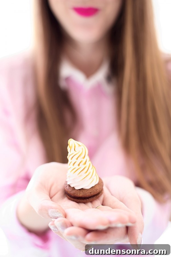 Sugar Fix: Cake Monkey — Unique Dessert Recipes & Treat Ideas 9 Someone holding a mini cupcake