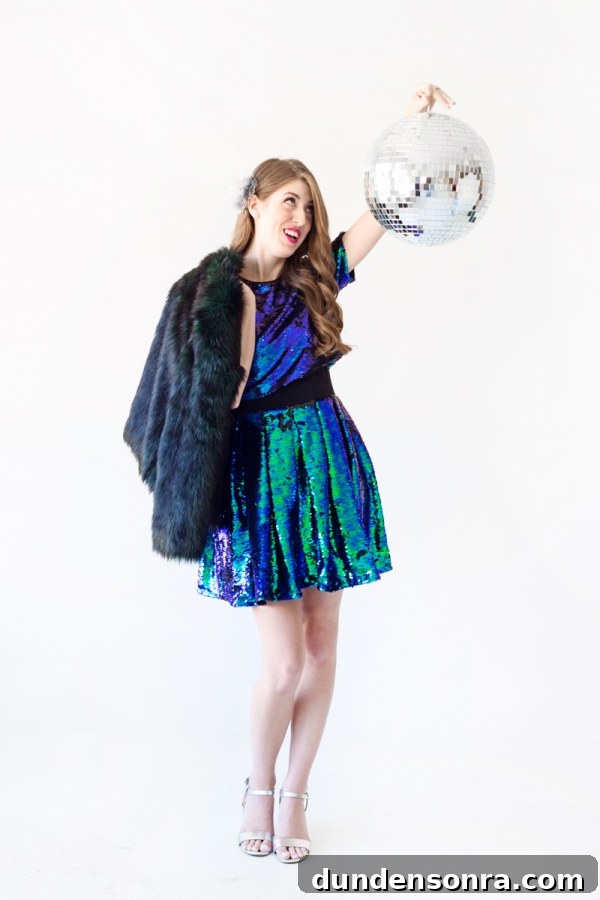 Sparkling Holiday Outfit Ideas: Head-to-Toe Party Looks 13 A woman wearing a blue and green sparkly dress