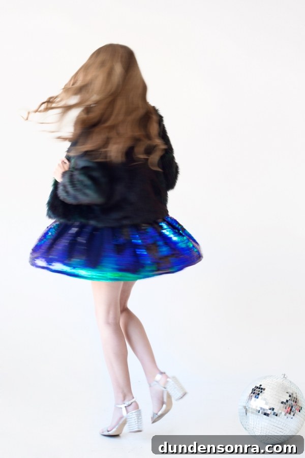 Sparkling Holiday Outfit Ideas: Head-to-Toe Party Looks 18 Someone spinning in a black dress
