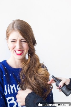 A woman with brown hair smiling