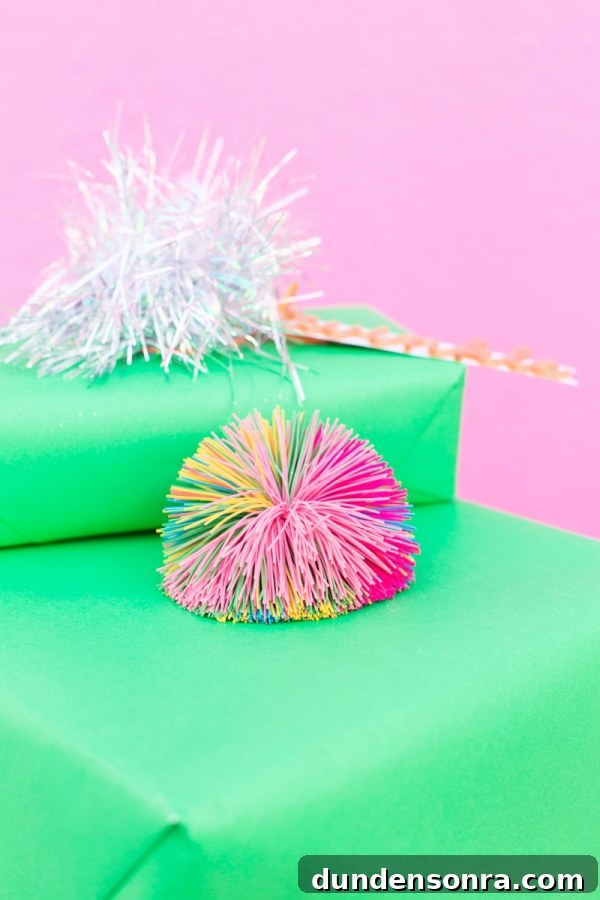 4 Stylish Holiday Gift Wrap Pairings to Impress Recipients 6 Koosh Ball Gift Topper