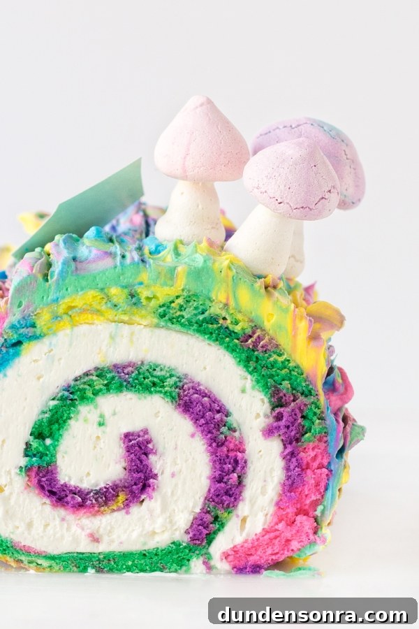 Rainbow yule log dessert with mushrooms