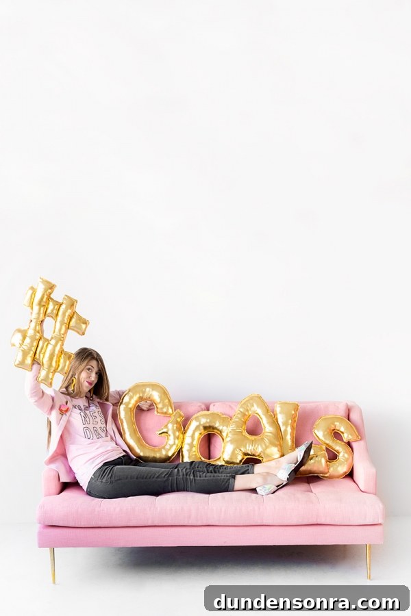 DIY Letter Balloon Pillows: Creative Gift Ideas for Best Friends 8 A woman sitting on a couch with gold balloons