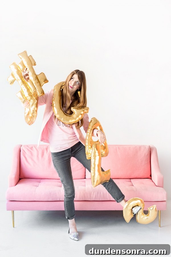 DIY Letter Balloon Pillows: Creative Gift Ideas for Best Friends 9 Someone holding a bunch of gold balloons