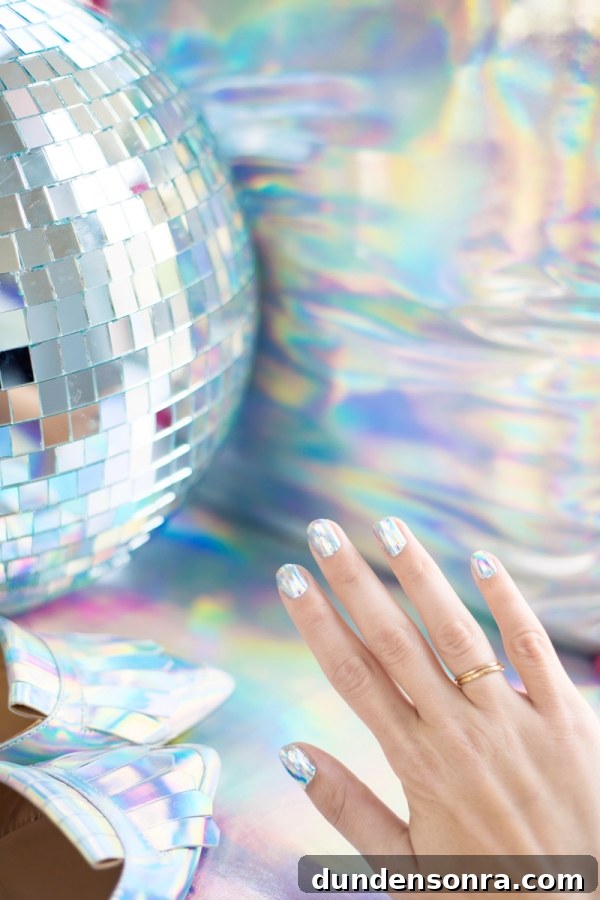 Someone's hand with holographic nail polish
