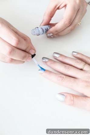 A woman getting her nails painted 