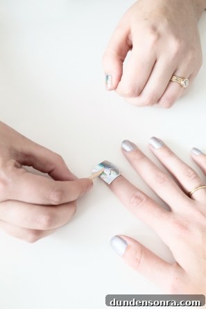 A woman getting her nails painted