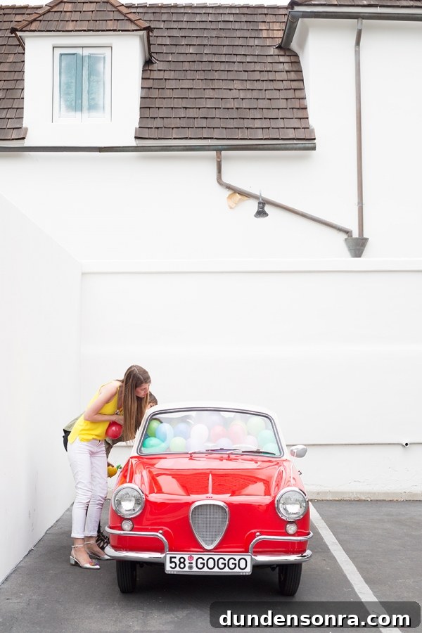 A car filled with balloons and a woman 
