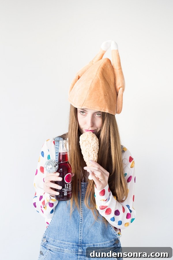 A woman wearing a chicken hat
