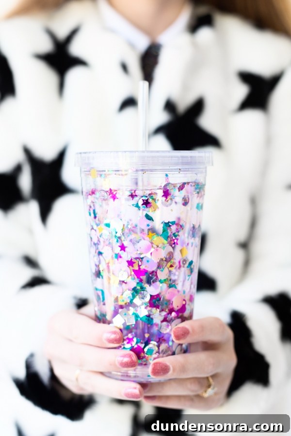 How to Make a Floating Glitter Tumbler: Step-by-Step Guide 3 Someone holding a cup with glitter