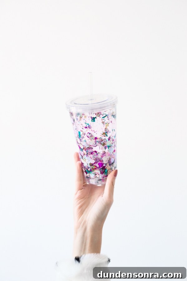 How to Make a Floating Glitter Tumbler: Step-by-Step Guide 6 A woman holding a cup with sparkles