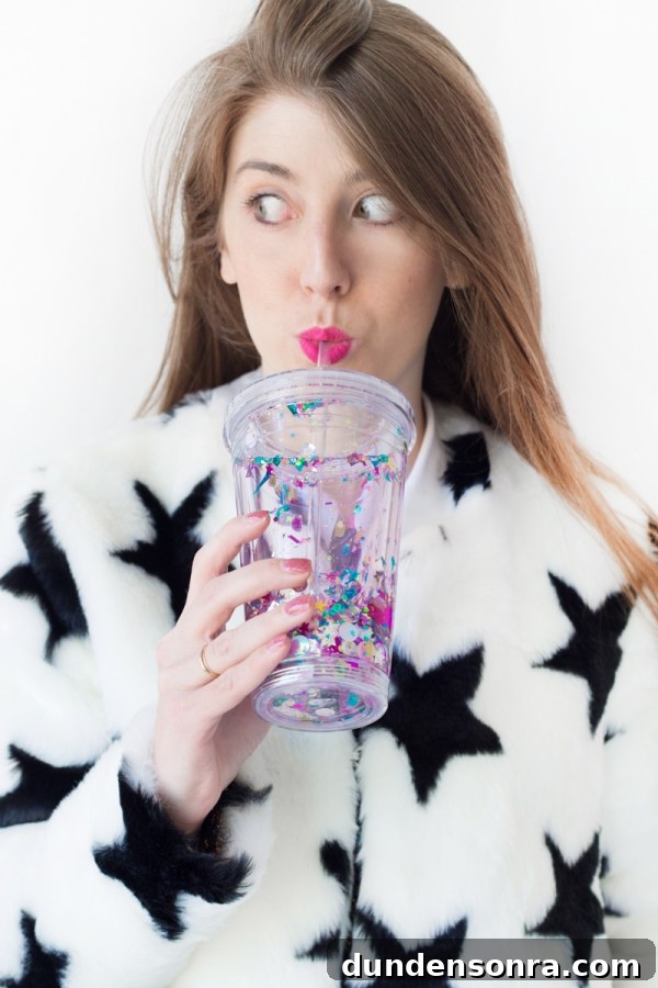 How to Make a Floating Glitter Tumbler: Step-by-Step Guide 8 A woman holding a cup with glitter on it