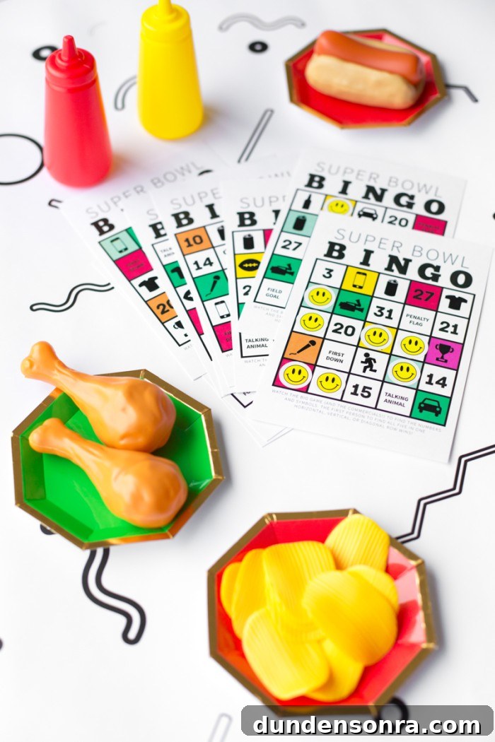 super bowl bingo cards with fake food on plates on white patterned table