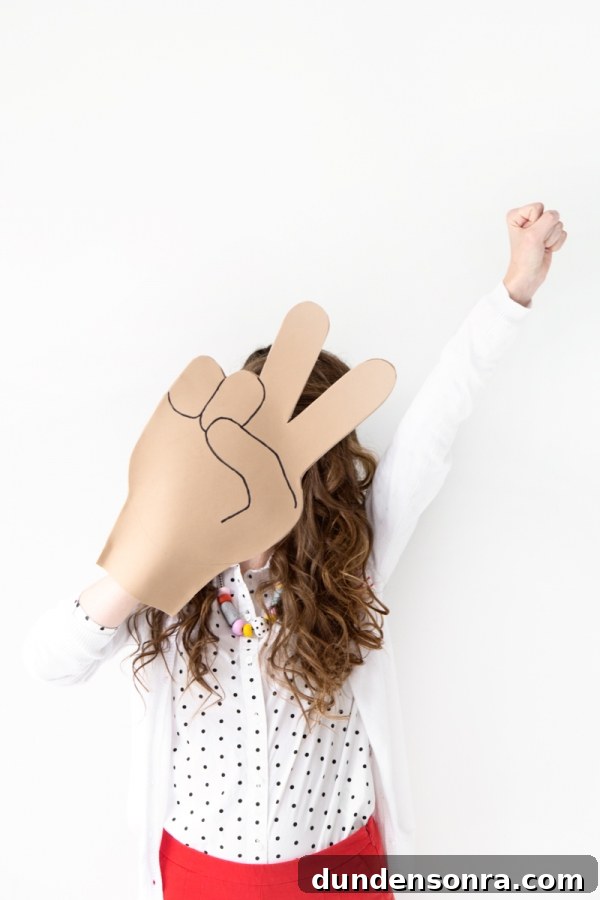Someone holding emoji foam fingers