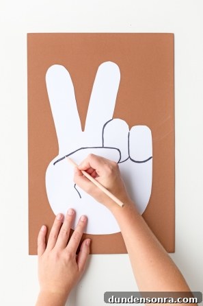 Someone drawing on a white paper
