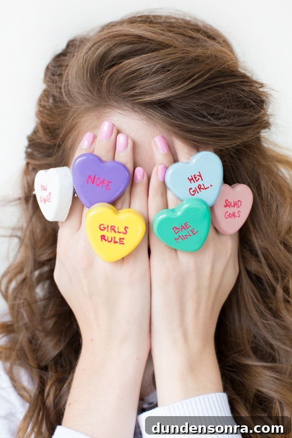 DIY Conversation Heart Rings: Make Cute Candy Heart Jewelry at Home 11 Someone wearing heart rings