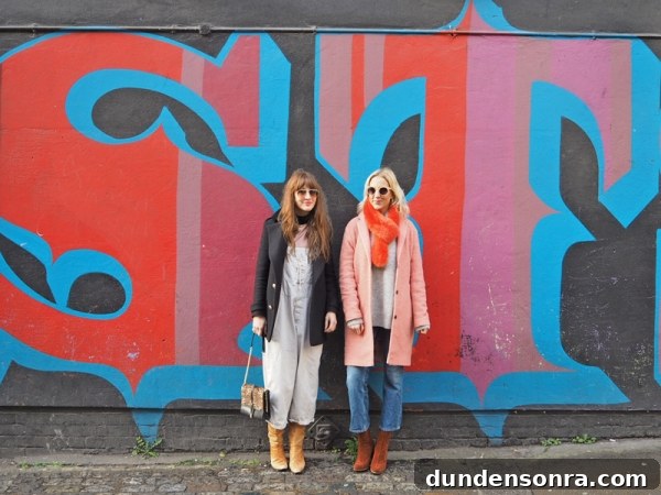 Top London Walls for Studio DIY and Urban Photography 6 Two girls standing in front of a colorful wall