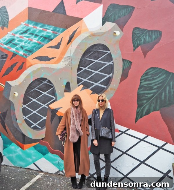 Top London Walls for Studio DIY and Urban Photography 7 Two girls standing in front of a mural