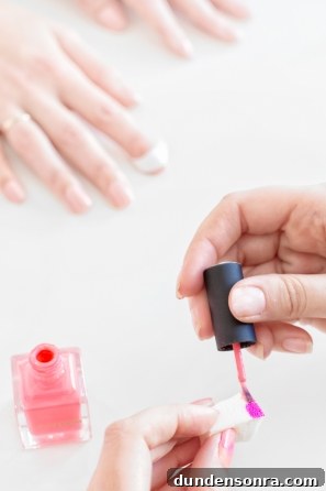 Someone holding nail polish 