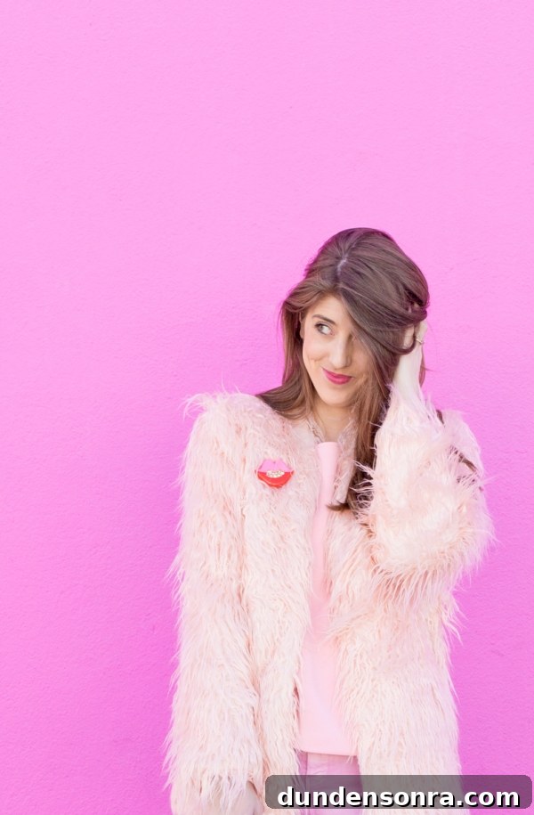 3 Stylish Ways to Wear Light and Monochrome Outfits 3 A woman wearing a pink fur jacket
