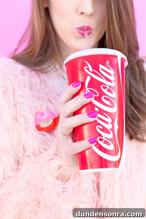 3 Stylish Ways to Wear Light and Monochrome Outfits 9 Someone holding a coca cola cup