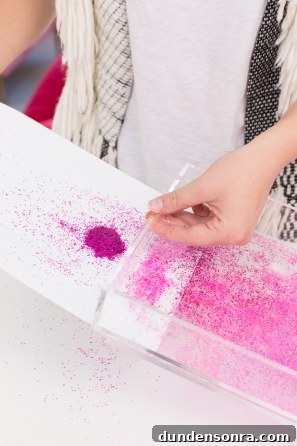Make Your Own Sparkling Resin Glitter Tray: Simple DIY Guide 6 Someone holding a tray of pink glitter